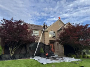 4K Roofing crew during a roof replacement on a brick home in Broadview Heights, Ohio