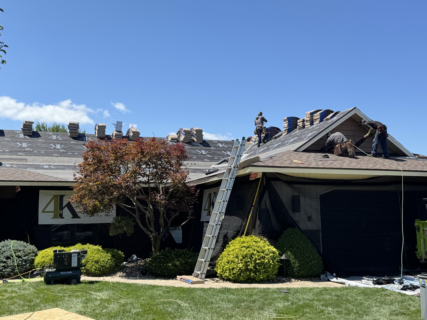 4K Roofing crew installing a new roof in a North Ridgeville neighborhood