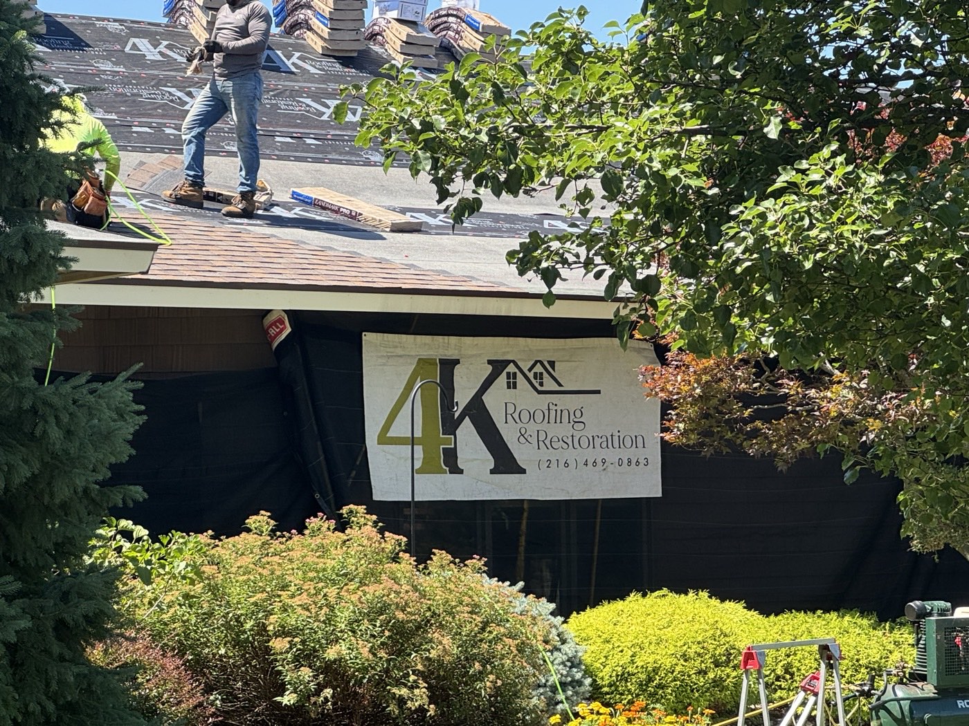4K Roofing and Restoration banner at a North Ridgeville roof replacement